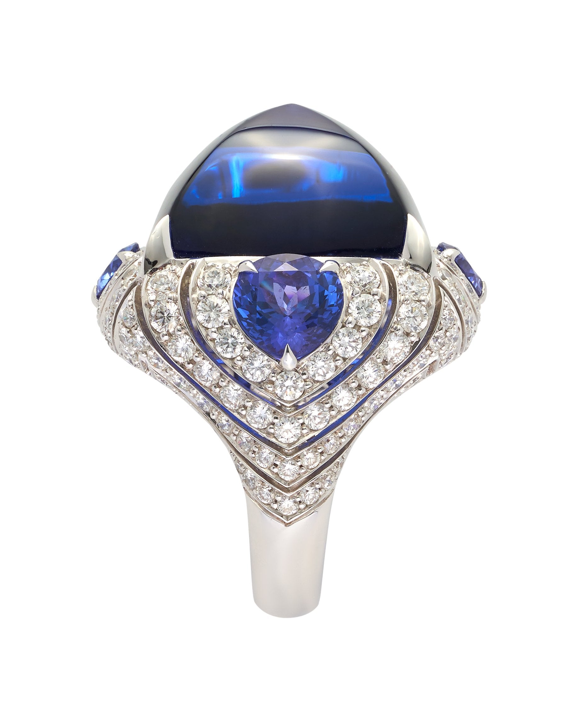 Cabochon tanzanite ring set with diamonds, crafted in 18 karat white gold.