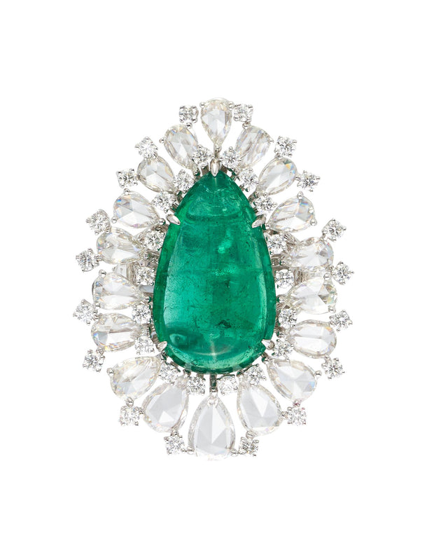 Cabochon emerald surrounded by round brilliant cut and rose cut diamonds, crafted in 18 karat white gold.