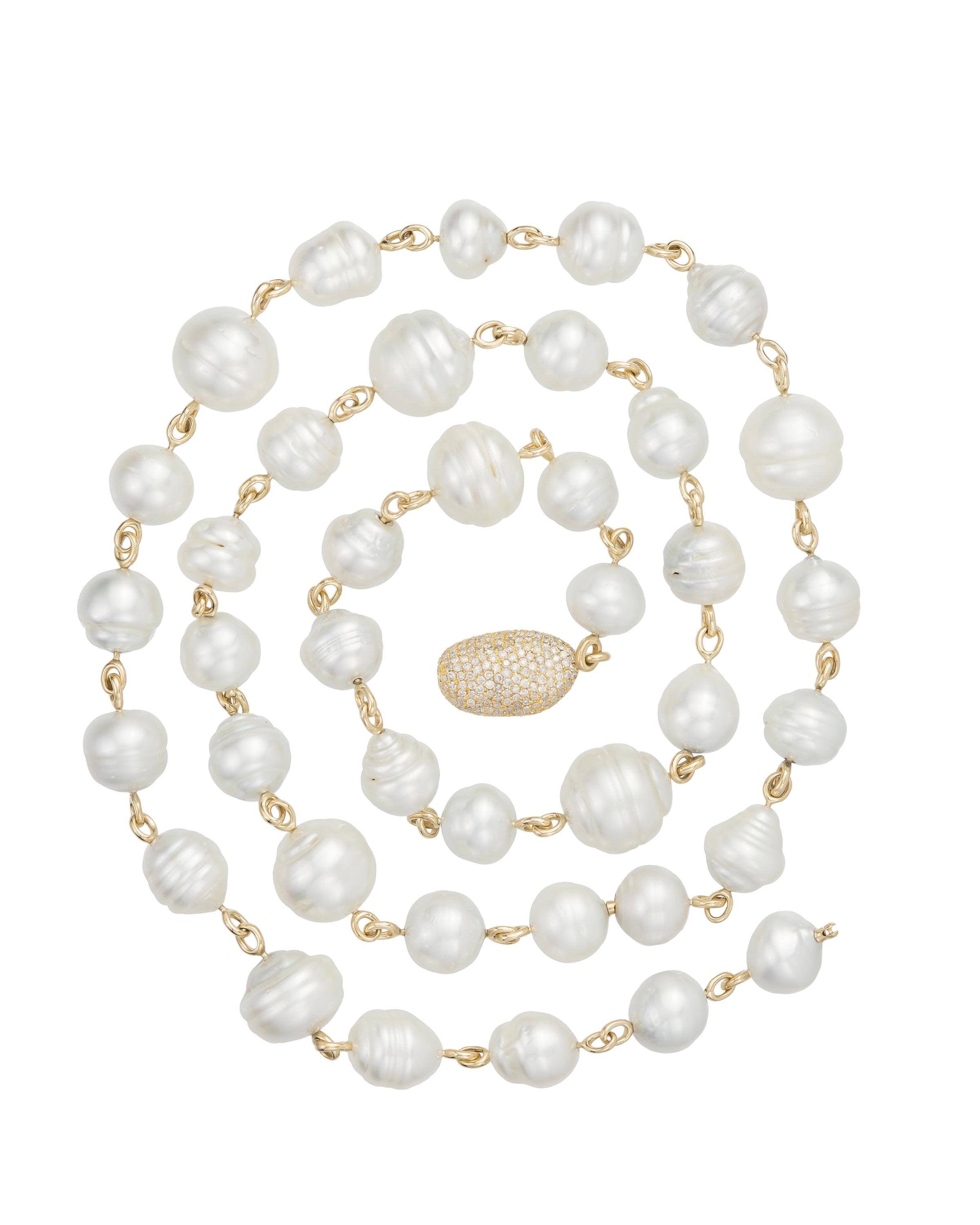 South Sea pearl necklace featuring grey white and golden tone Australian baroque pearls and pave diamond pebble set with diamonds, crafted 18 karat yellow gold.