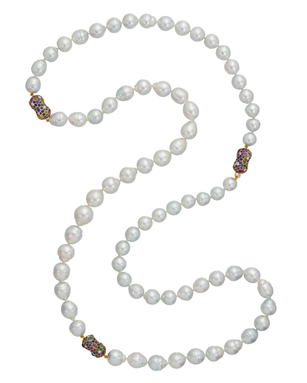 South Sea pearl strand with multi stone 'peanuts', crafted in 18 karat yellow gold.